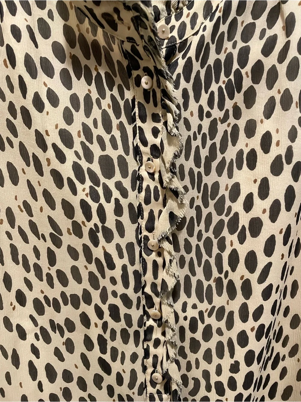 J.Crew silk blouse features a sleeveless design and a cheetah print. Size 2.